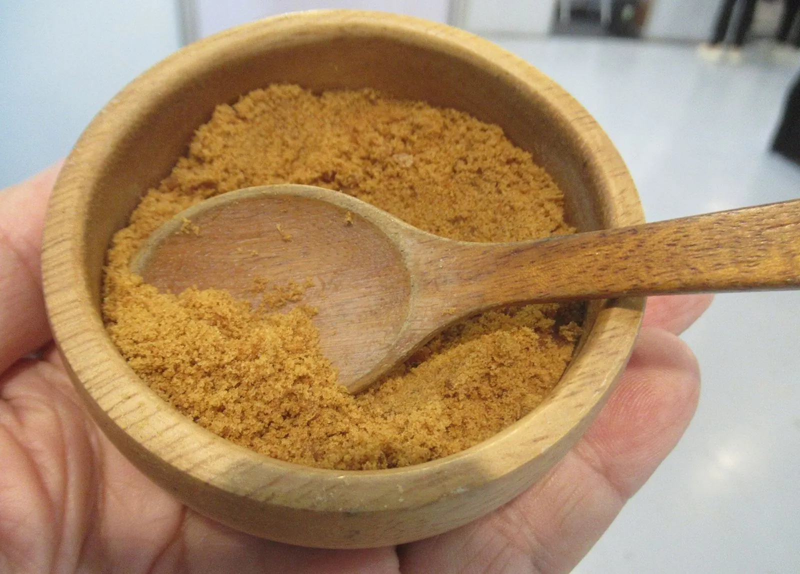 Organic coconut sugar in a wooden bowl